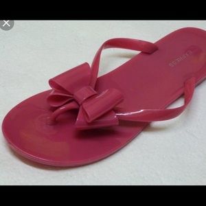 EXPRESS hot pink jelly bow flip flops