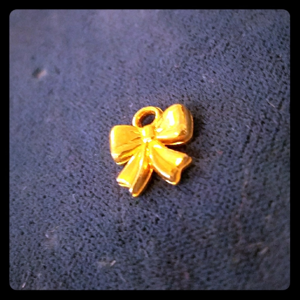 Golden bow charm