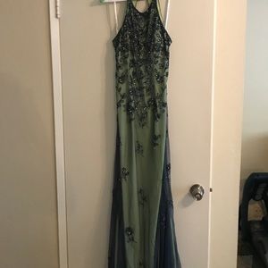 Green gown with sheer navy blue overlay & beading