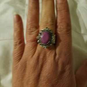Antiquated silver stretchy ring with purple stone