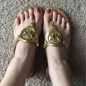 Michael Kors thong sandals, gold. Size 5