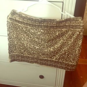 Sparkly mini skirt in muted gold.