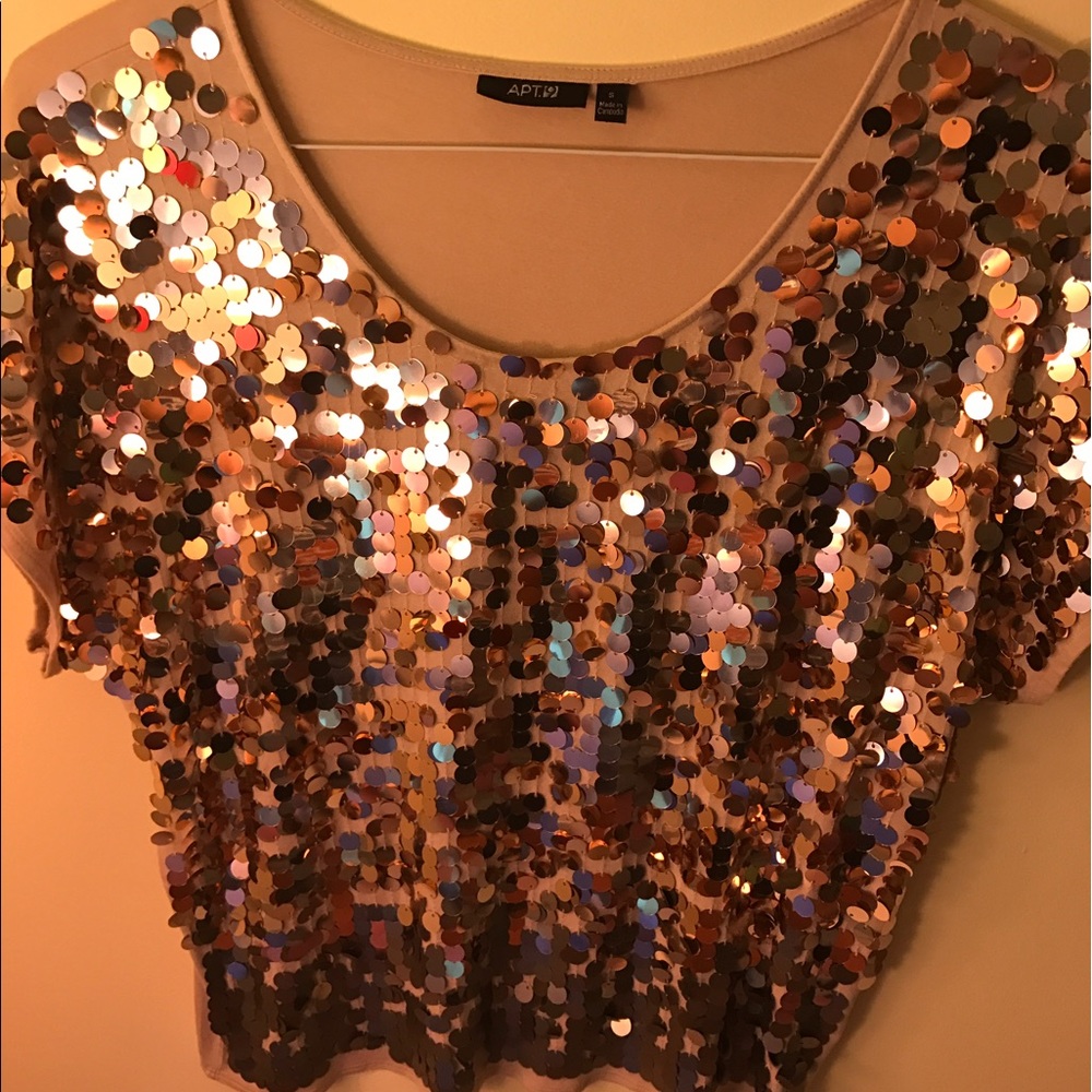 A gold sequin blouse