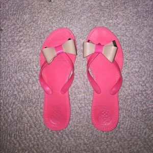 Pink with a tan bow Vince Camuto flip flops