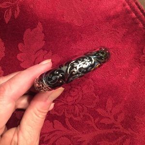 Black and silver bracket with hinged clasp