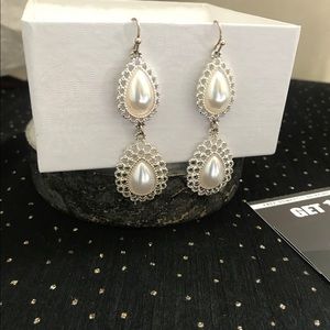 Dangling pearl earrings