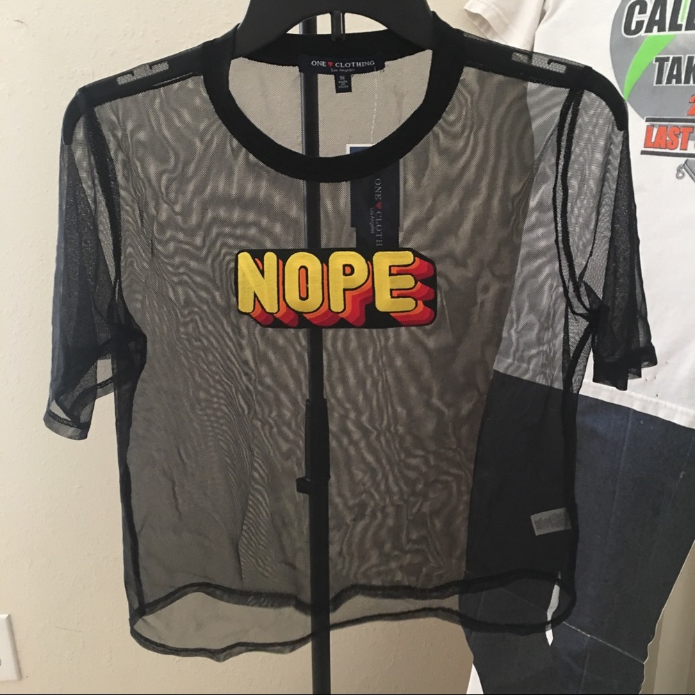 SEE THROUGH BLACK SHIRT WITH "NOPE" WRITTEN ON IT