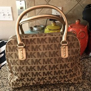 AUTHENTIC gold MK bowling style handbag.