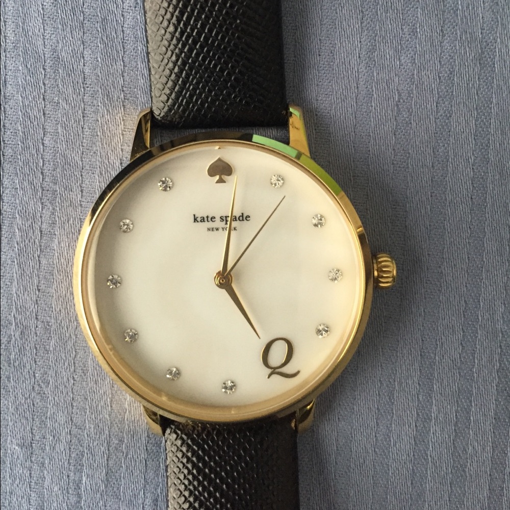 Kate Spade metro monogram "Q" leather strap watch.