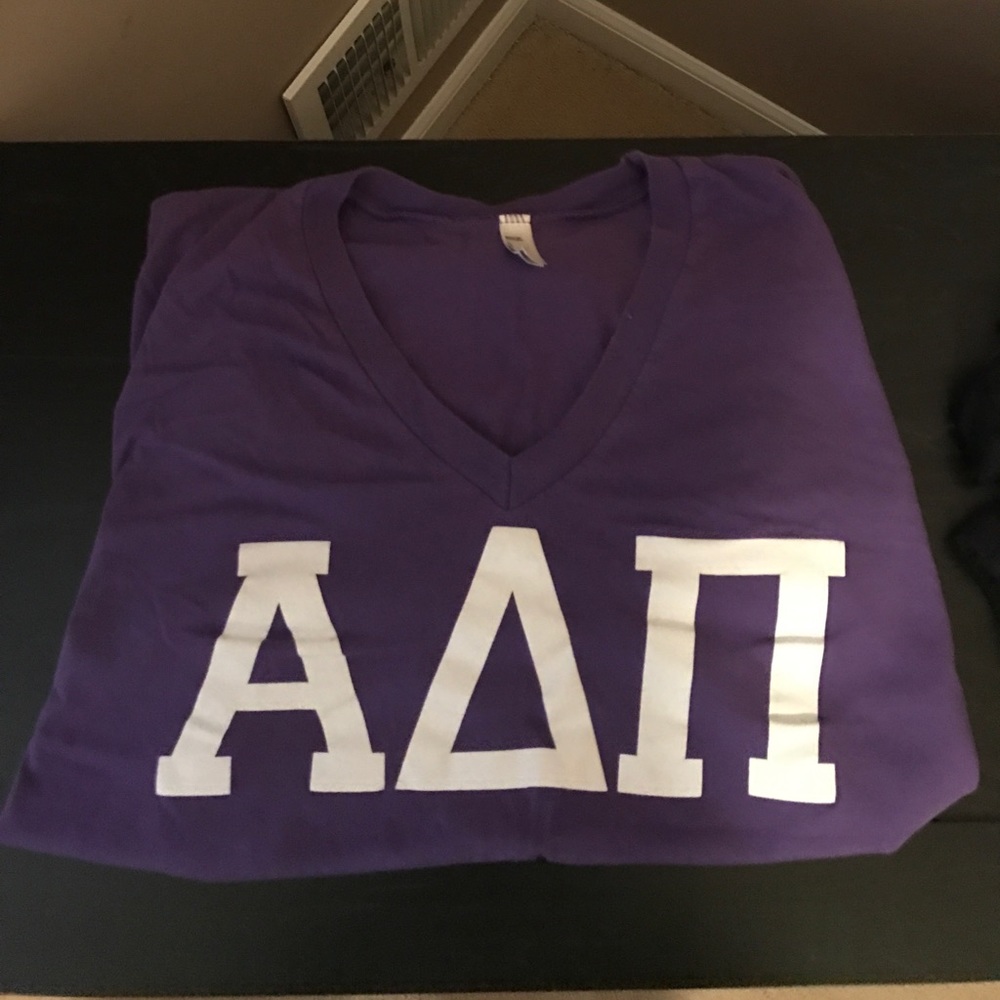 ADPI letters purple tee with white letters