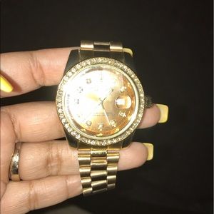 Gold day date Rolex