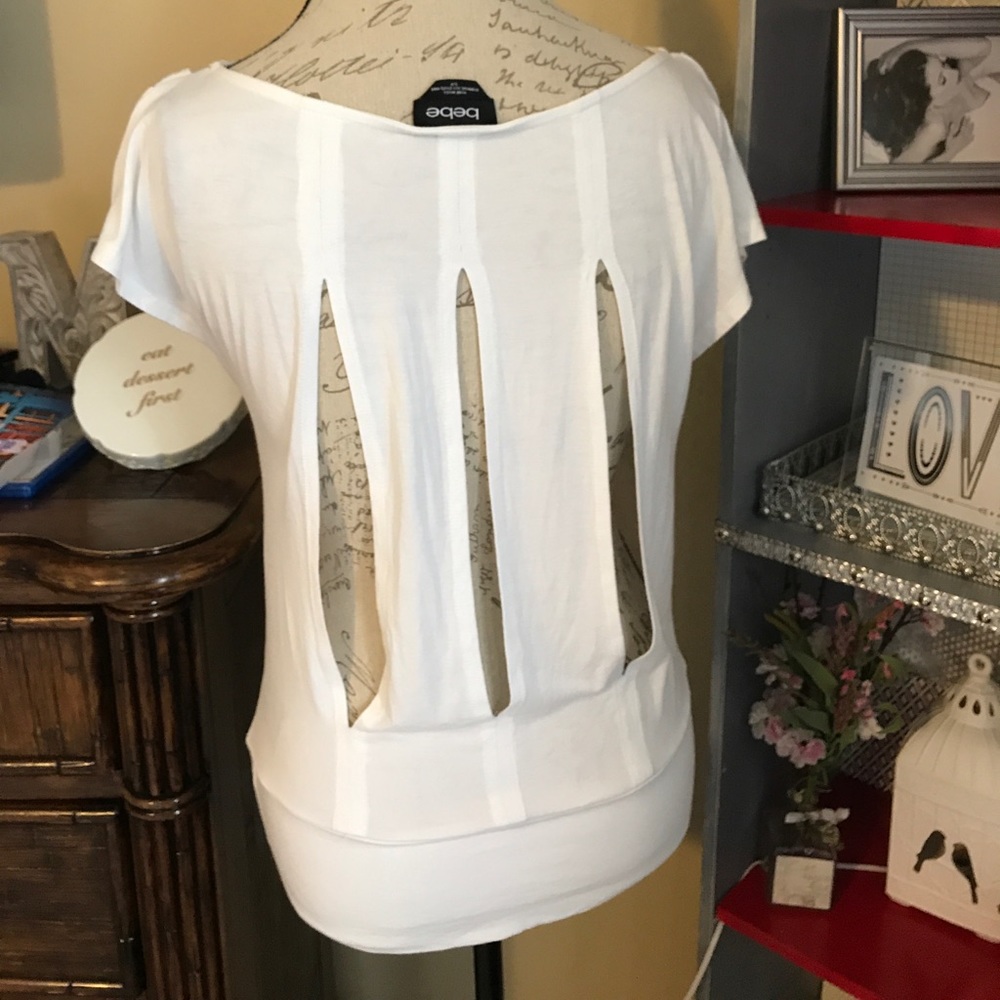 Flattering Bebe top off white.
