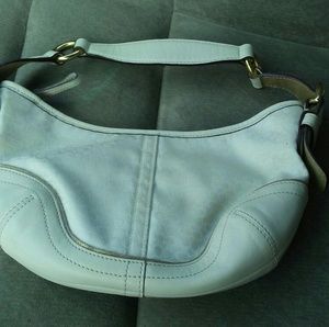 White and gold coach purse