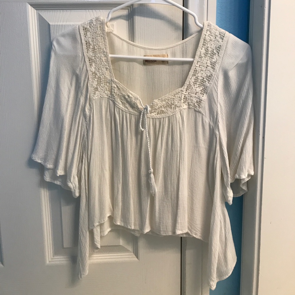 Flowy white blouse with nice crochet detailing!