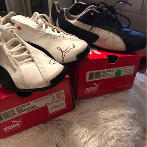 2 pairs of pumas white &black and black& silver