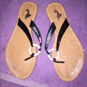 Back and silver flip flops