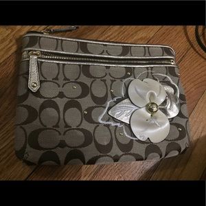 Coach signature clutch.