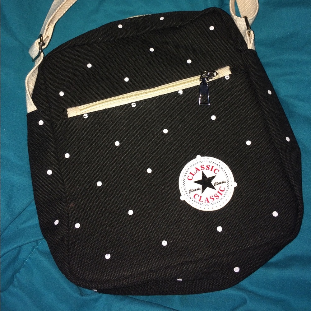 Black and white poke-a-dot purse.