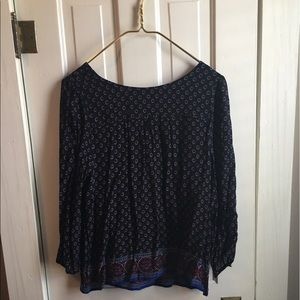 Navy blue with flower print shirt.