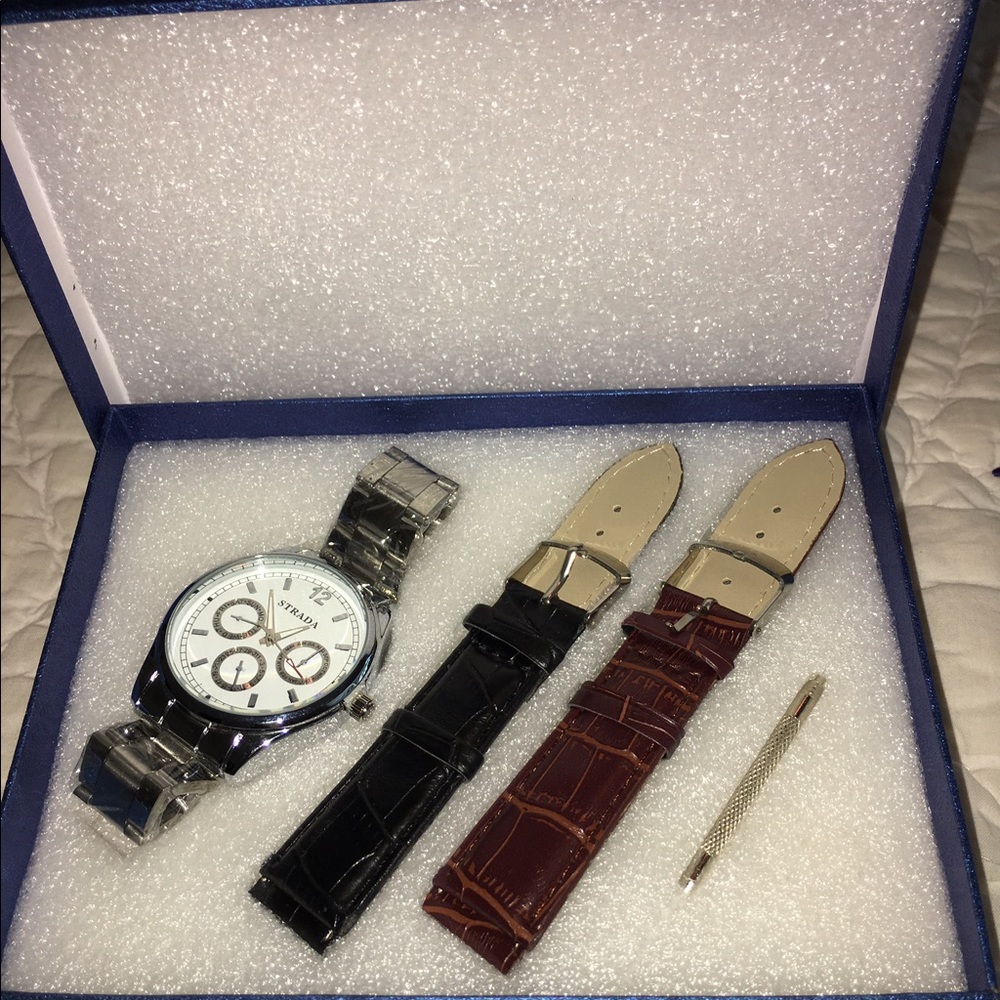 Swiss lite weight silver with two leather bands.