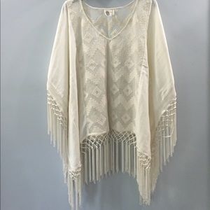White poncho from Anthropologie