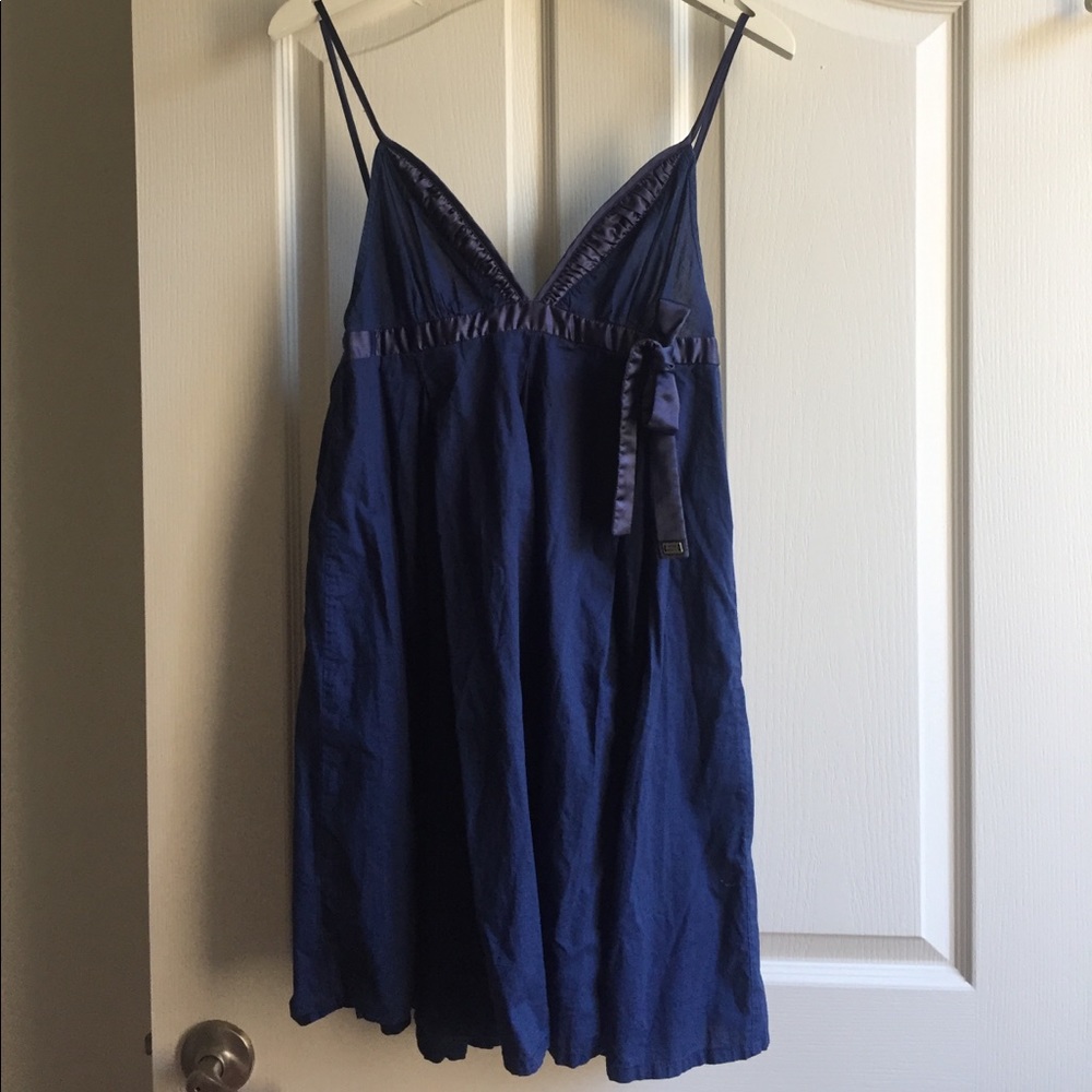 Navy blue summer dress with adjustable bands.