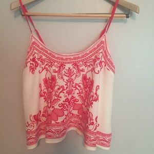 Flowy cropped tank with amazing color and print!