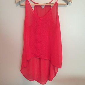 Red flowy tank. Normal front. Cover booty back!!!