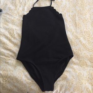 Black, scalloped bathing suit.