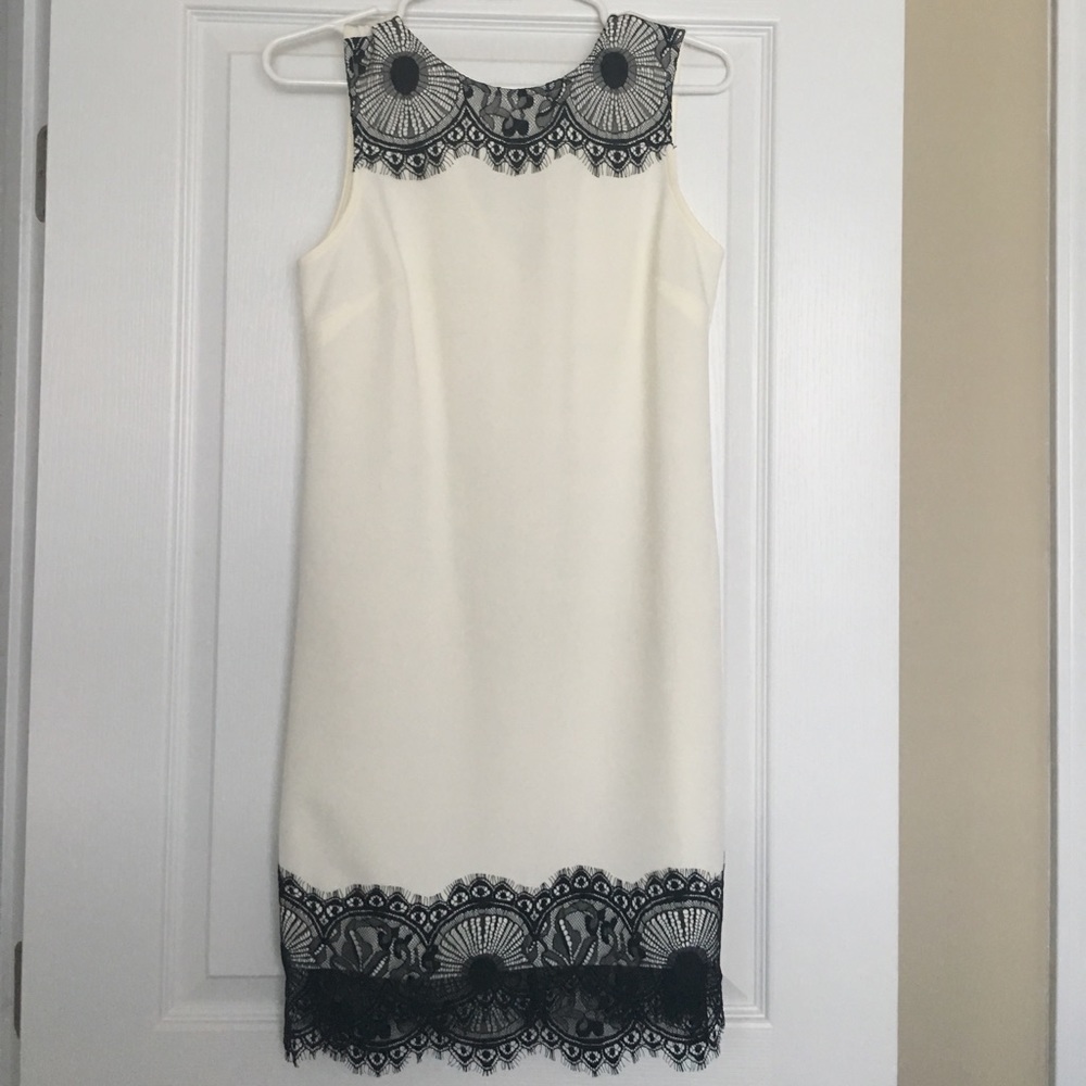 White dress with black lace trim