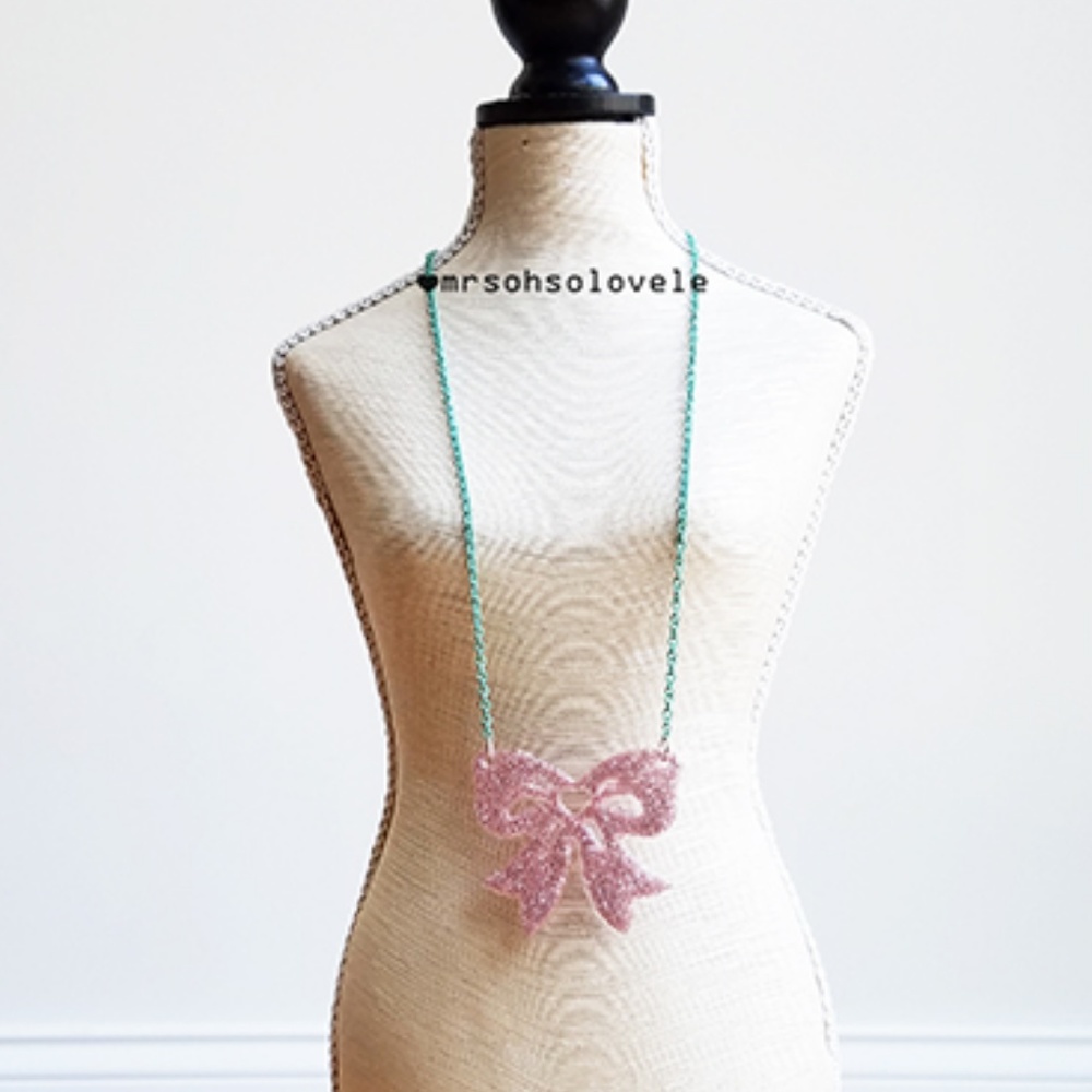 Mint green necklace with acrylic pink glitter bow