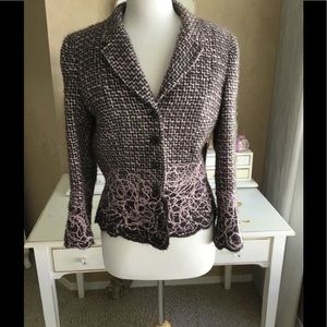 A Short Brown, Pink and White Tweed Jacket.