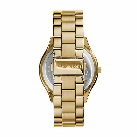Micheal Kors gold runway watch wiling to trade