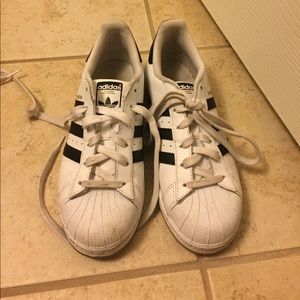 Women's adidas super stars.