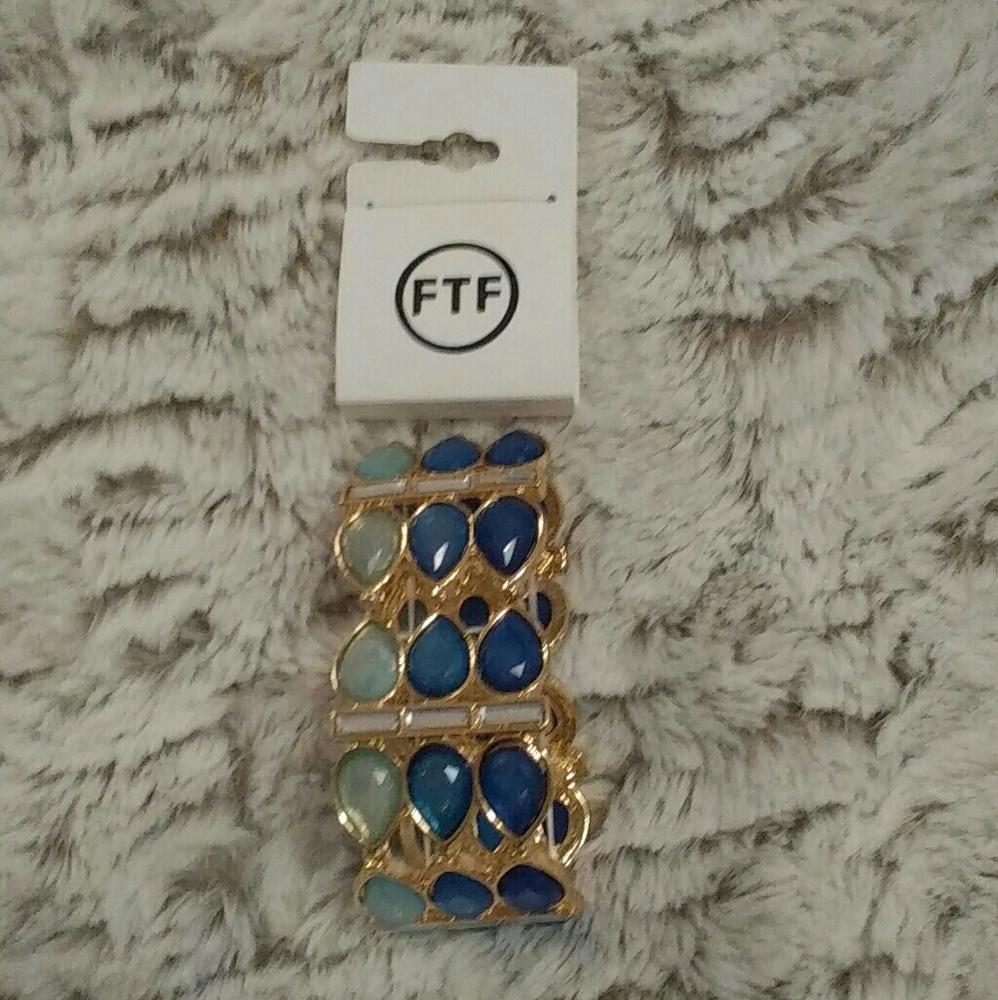 NWT  blue/gold stretch bracelet.