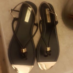 Flat black and gold sandals