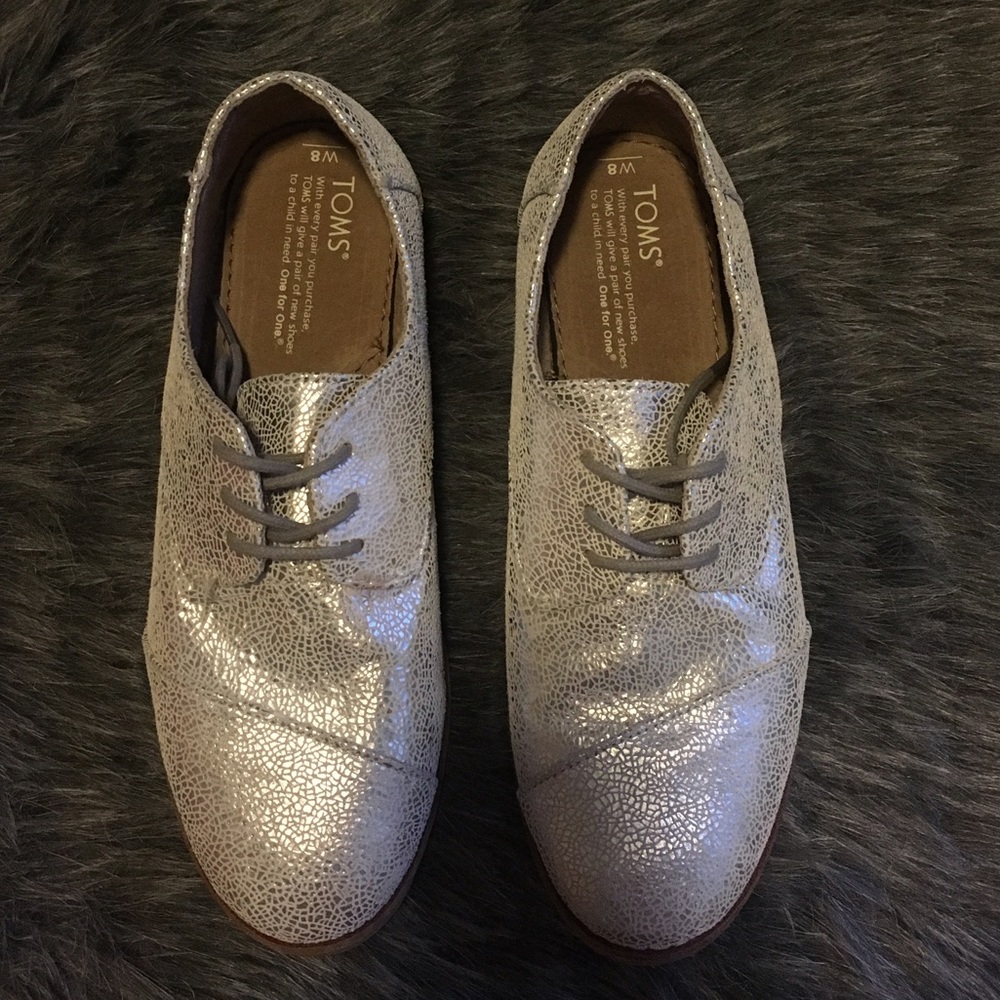 Silver lace up Toms