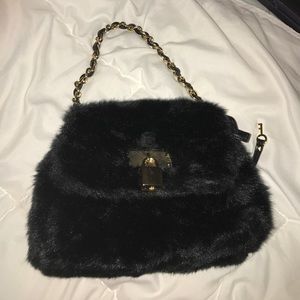 NEVER USED Fury black and gold mini handbag