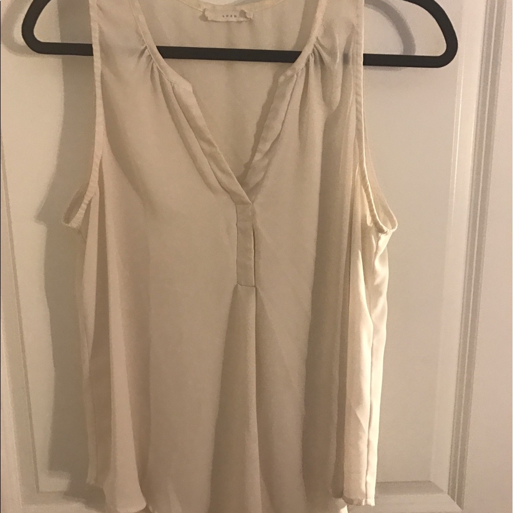 Cream sleeveless blouse