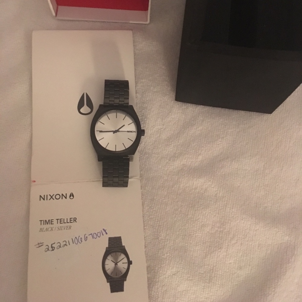 Black all metal Nixon watch