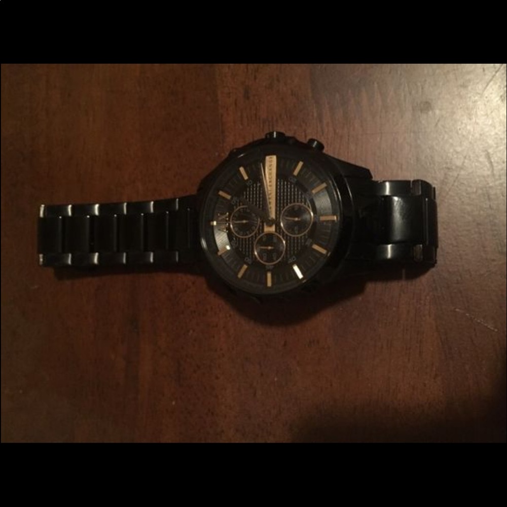 Armani exchange black and gold watch. Never worn!