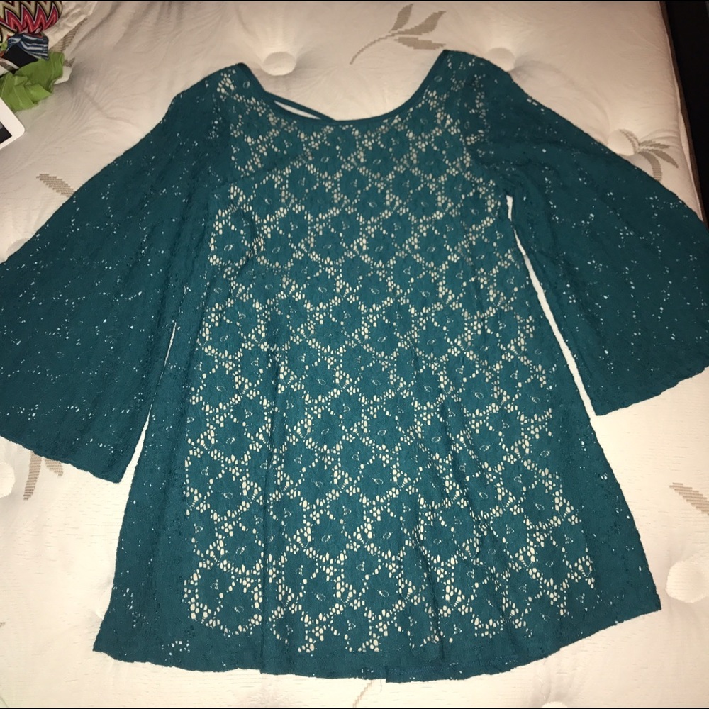 Teal lace shirt with nude underlay and bell sleeve