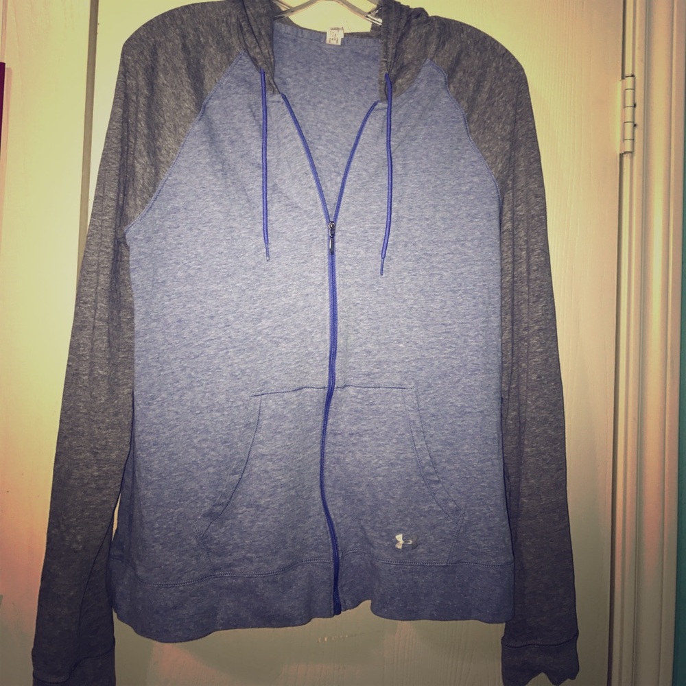 Blue and grey woman's Under Amour jacket.