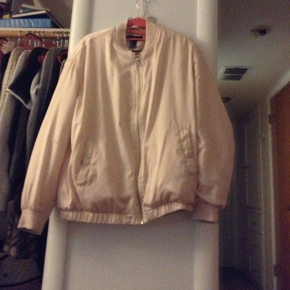 A 100 % polyester baby pink bommer jacket