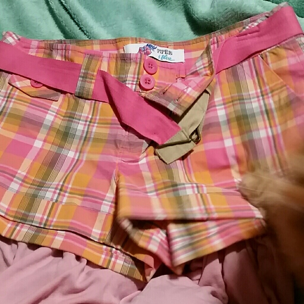 Brand new 3 pocketed pair of shorts w/ pink belt