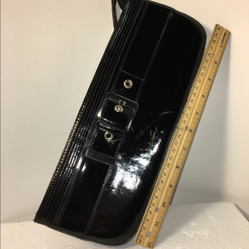 Patent leather clutch with buckle accent