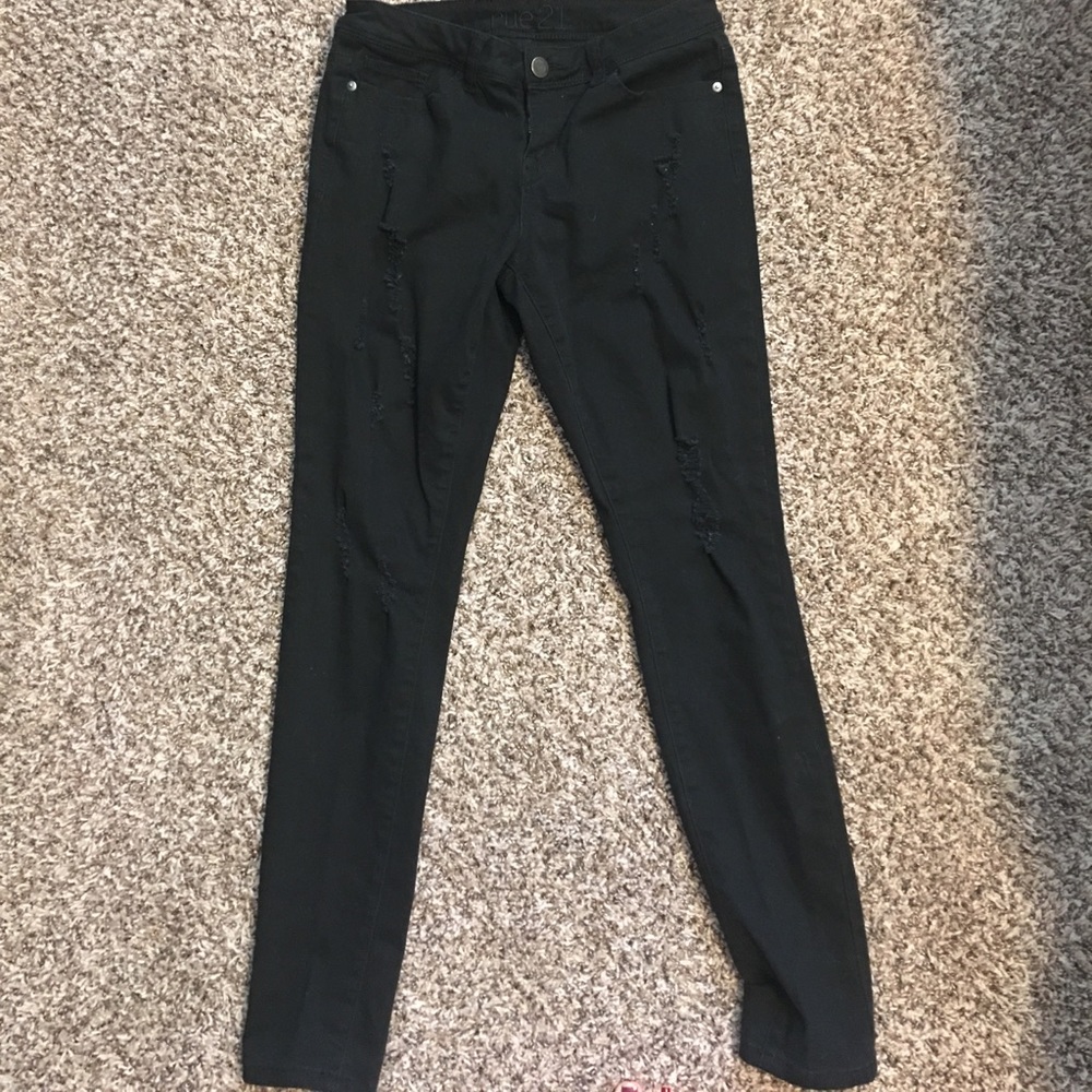 Black distressed jeans.