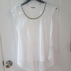 Black neckline and white blouse