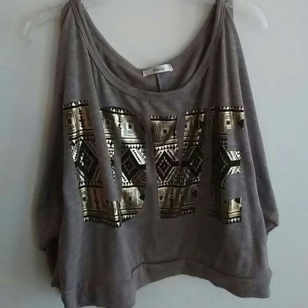 Love cropped slit sleeve shirt.