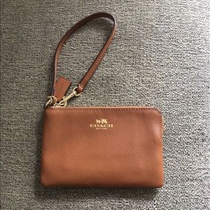tan and gold, coach wristlet